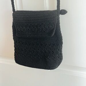 Small black crocheted crossbody handbag with long strap